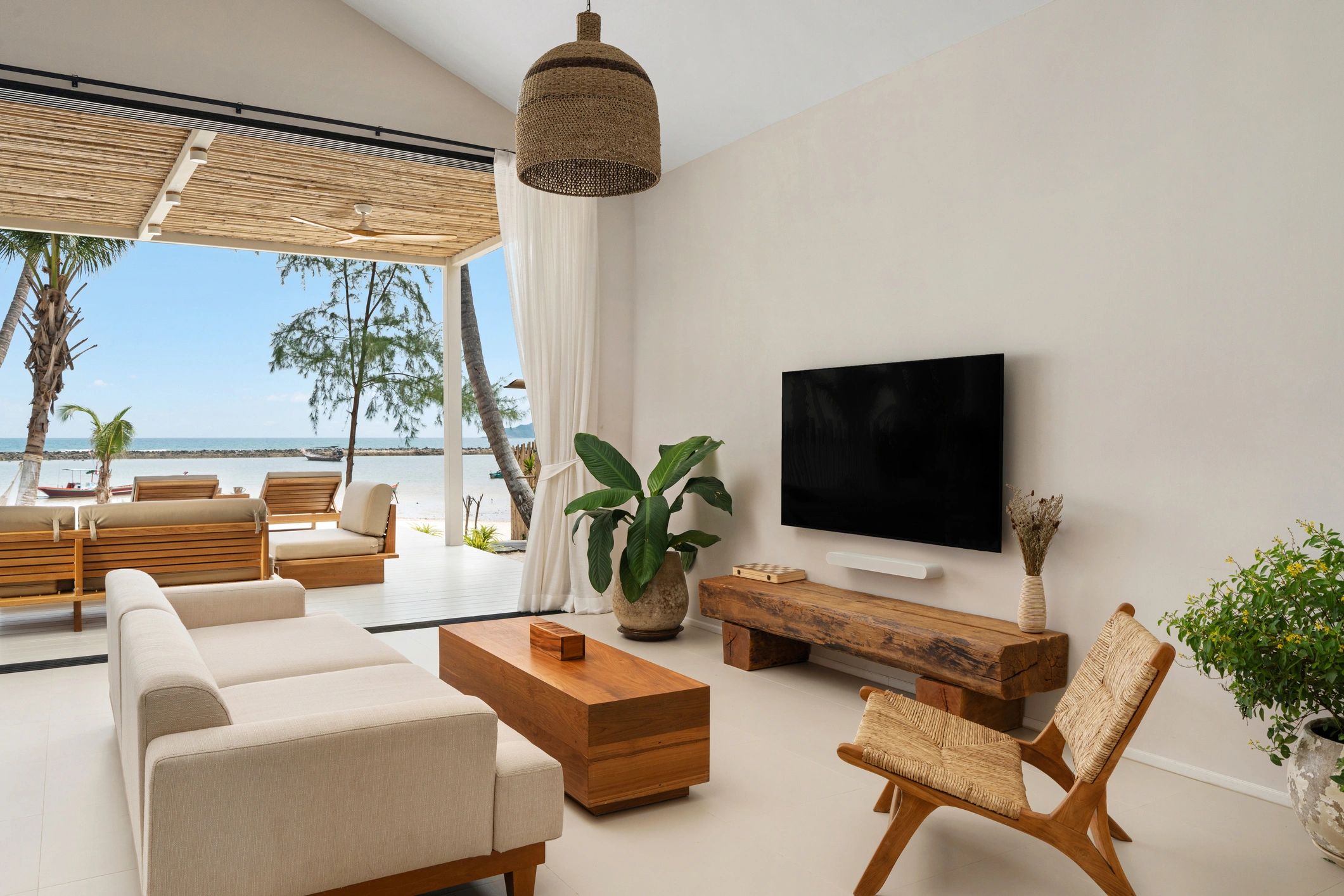 Bright luxury villa living room with balcony and ocean view