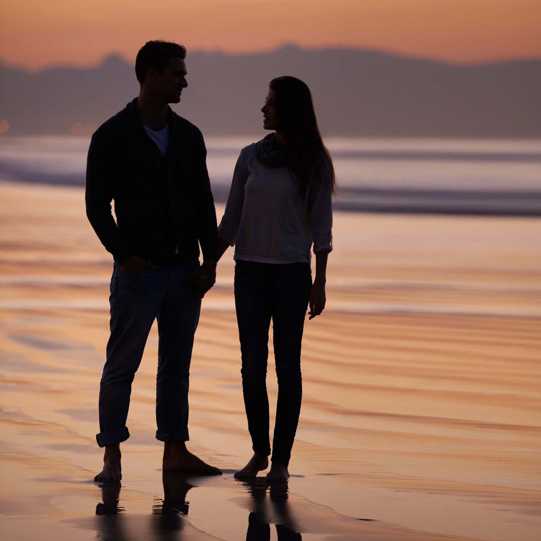 Silhouette of a couple on the beach
